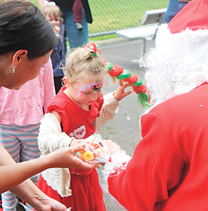 The Young Dairy Network welcomed many attendees at their event last month, with Santa giving out lollies and a warm welcome to the children, including young Gippsland farmer Bella (4).