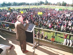 Prime Minister John Howard at Sale Oval shortly after the Port Arthur massacre in 1996. Howard famously wore a bulletproof vest while speaking to the pro-gun crowd. File photo