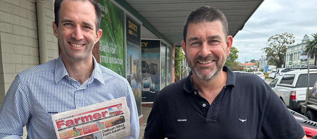 Rabobank senior macro strategist Ben Picton (left) and senior analyst for dairy and consumer foods Michael Harvey with a Gippsland Farmer paper. Photo: Stefan Bradley