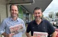 Rabobank senior macro strategist Ben Picton (left) and senior analyst for dairy and consumer foods Michael Harvey with a Gippsland Farmer paper. Photo: Stefan Bradley
