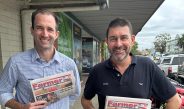 Rabobank senior macro strategist Ben Picton (left) and senior analyst for dairy and consumer foods Michael Harvey with a Gippsland Farmer paper. Photo: Stefan Bradley