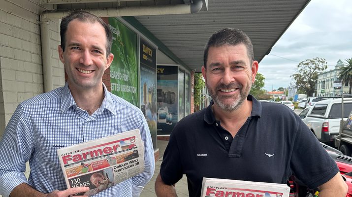 Rabobank senior macro strategist Ben Picton (left) and senior analyst for dairy and consumer foods Michael Harvey with a Gippsland Farmer paper. Photo: Stefan Bradley