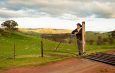 Aussie farmer looking out over a paddock stock image