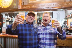Glengarry’s Peter Hodgson and Andrew Rodgers raised a Travla skoona for the Wear a Flanno for a Farmer fundraiser on Friday, August 14. Photos: Katrina Brandon